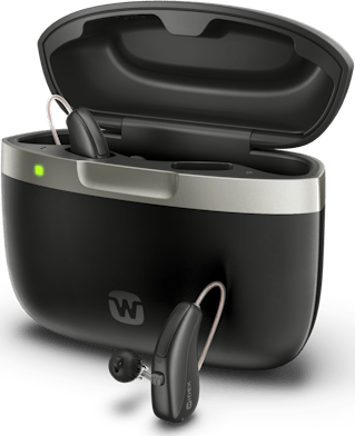 Widex Allure rechargeable hearing aids in their charger